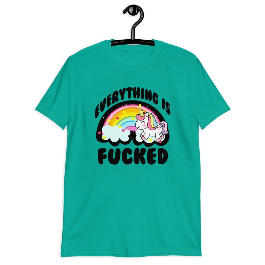 Jade color t-shirt with a graphic of a kawaii style unicorn and a pastel rainbow with the text 'Everything is fucked' printed on the front.