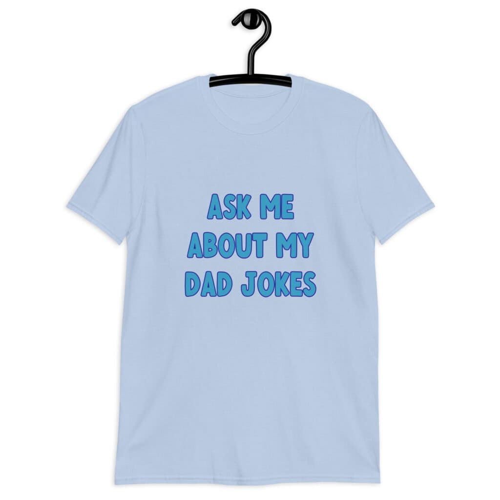 Light blue t-shirt with the text 'Ask me about my Dad jokes' printed on the front.