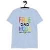 Light blue t-shirt with the text 'Free Dad hugs' printed on the front in rainbow letters.