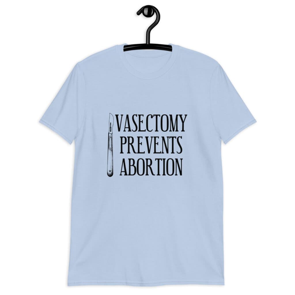 Light blue t-shirt that has an image of a surgical scalpel and the phrase 'Vasectomy prevents abortion' printed on the front.