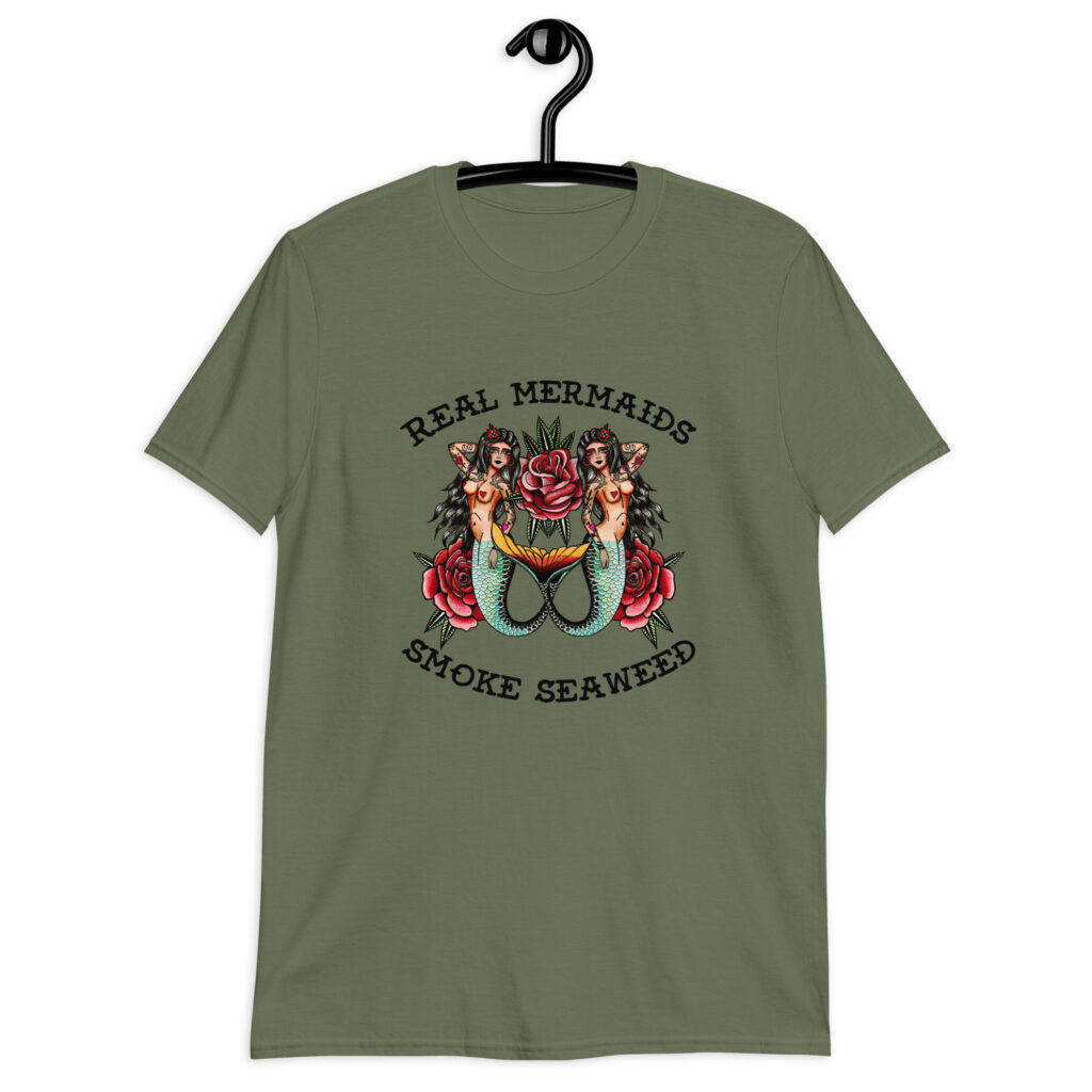Military green t-shirt with image of 2 mermaids and the text 'Real mermaids smoke seaweed' printed on the front.