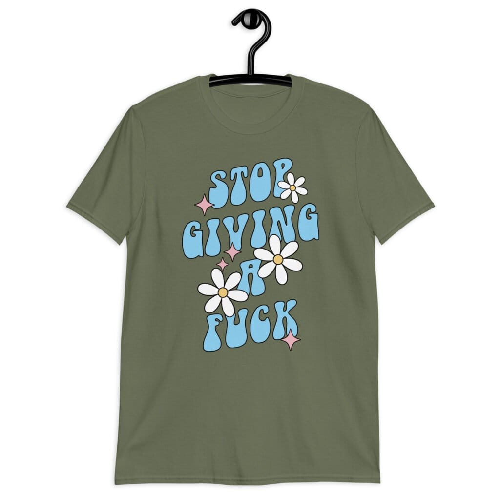 Military green t-shirt with a retro daisy and star design and the text 'Stop giving a fuck' printed on the front.