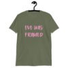 Military green t-shirt with the text 'Eve was framed' printed on the front in pink.