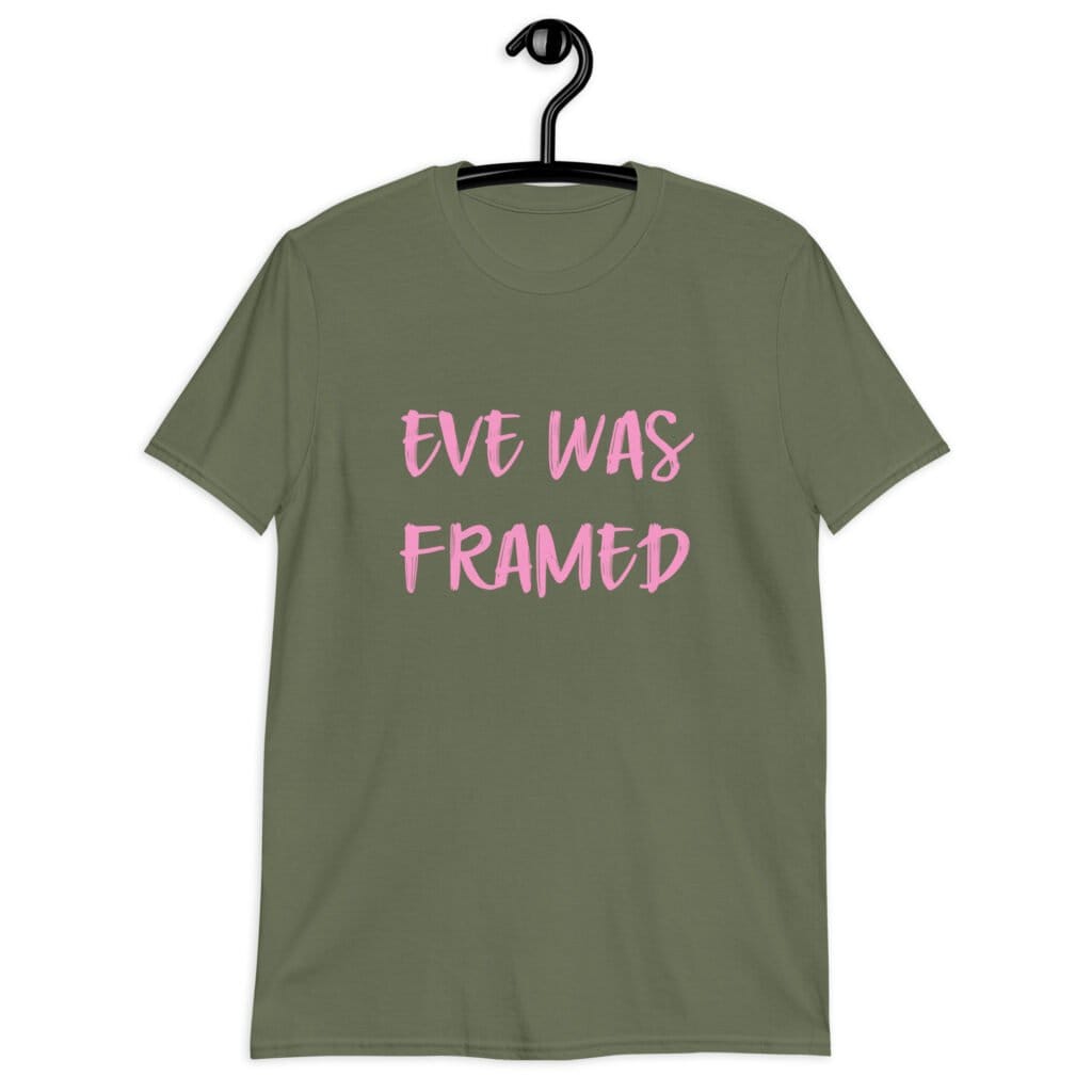 Military green t-shirt with the text 'Eve was framed' printed on the front in pink.