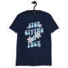 Navy blue t-shirt with a retro daisy and star design and the text 'Stop giving a fuck' printed on the front.