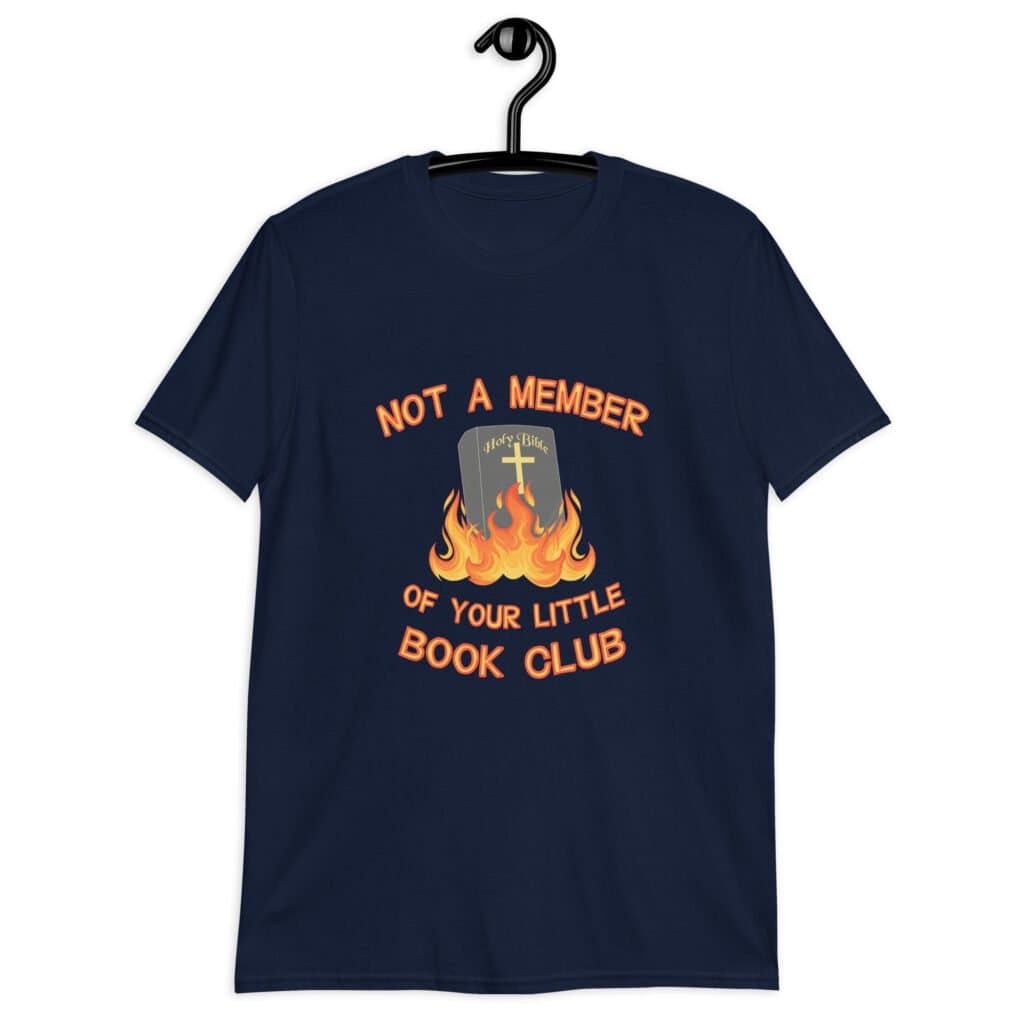 Navy blue t-shirt with image of a burning bible and the text 'Not a member of your little book club' printed on the front.