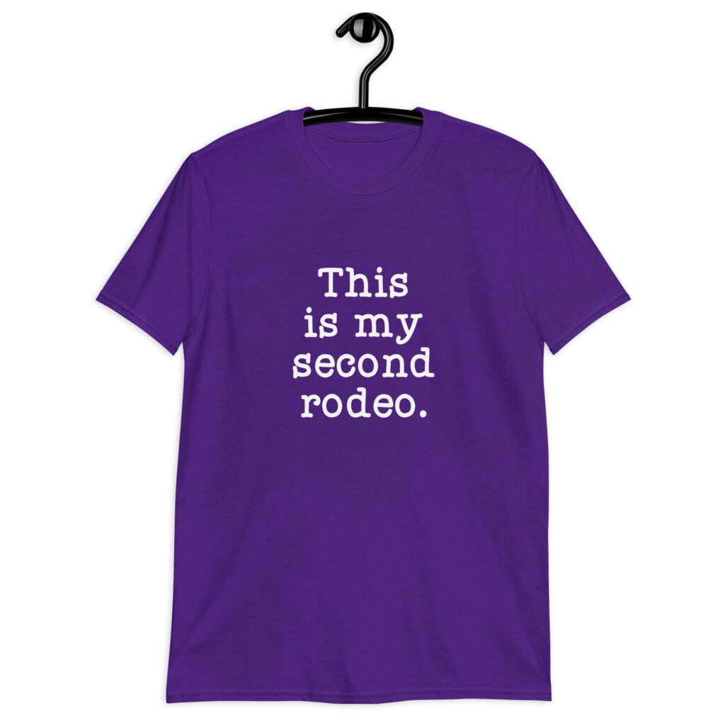 Purple t-shirt with the text 'This is my second rodeo.' printed on the front.