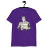 Purple t-shirt with graphic of a retro man holding sign that says 'Ladies, mansplaining is short for man explaining' printed on the front.