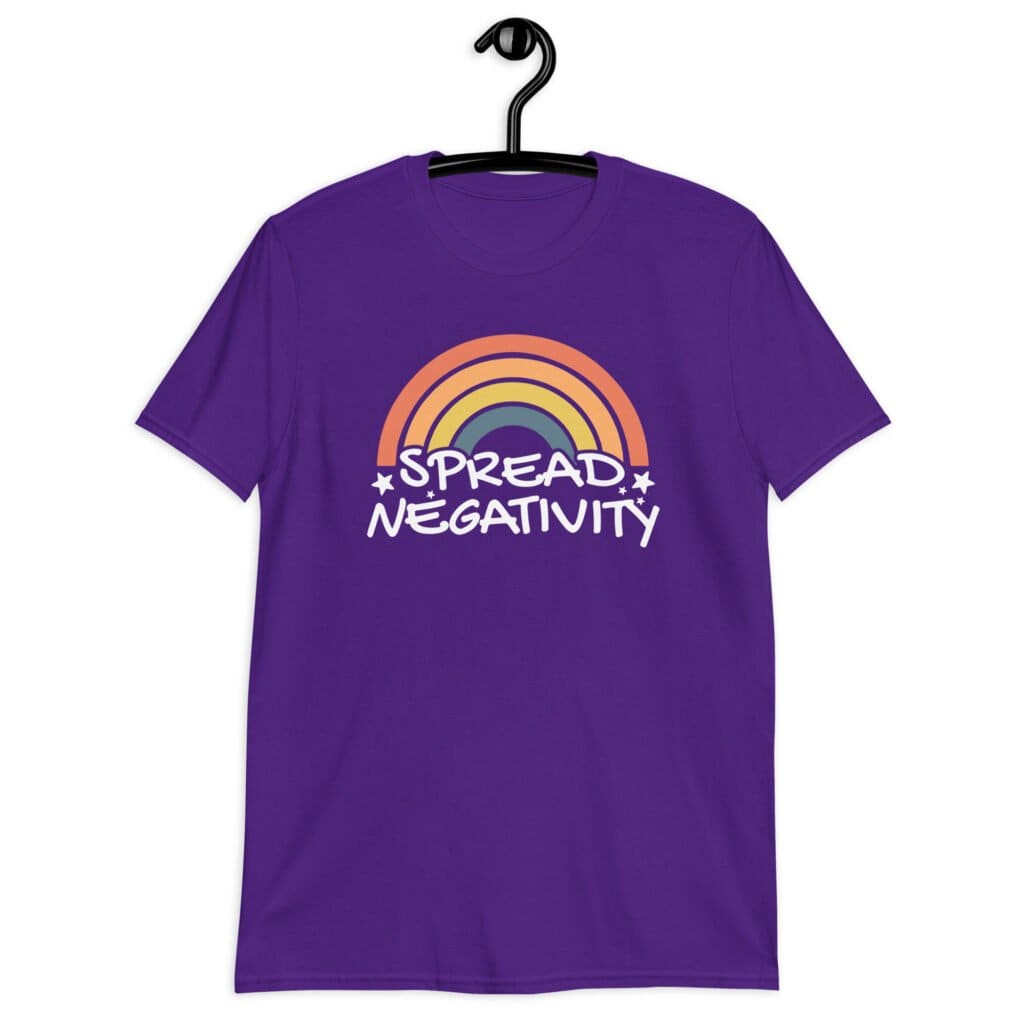 Purple t-shirt with a graphic of a rainbow and the words 'Spread negativity' printed on the front.