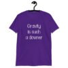 Purple t-shirt with the text 'Gravity is such a downer' printed on the front.