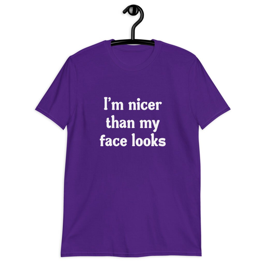 Purple t-shirt with the text 'I'm nicer than my face looks' printed on the front.