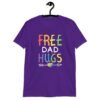 Purple t-shirt with the text 'Free Dad hugs' printed on the front in rainbow letters.