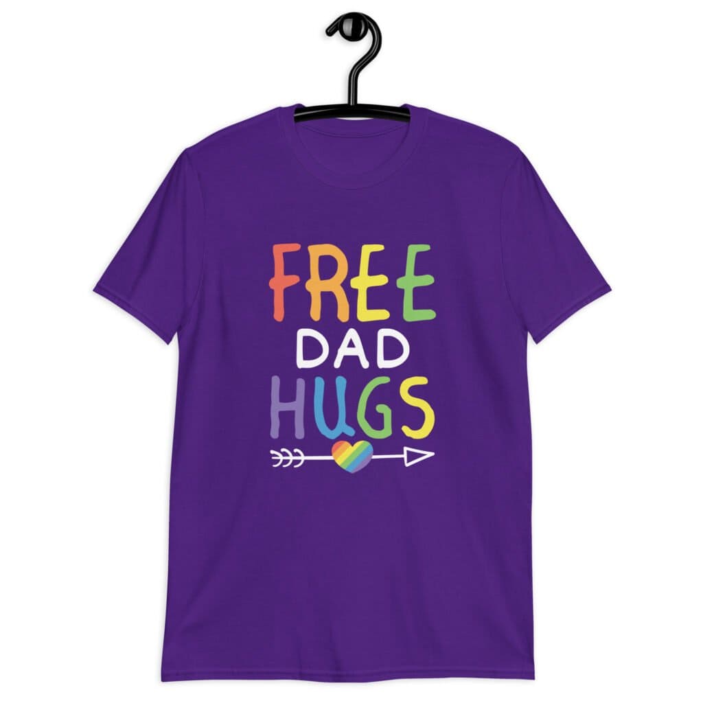 Purple t-shirt with the text 'Free Dad hugs' printed on the front in rainbow letters.