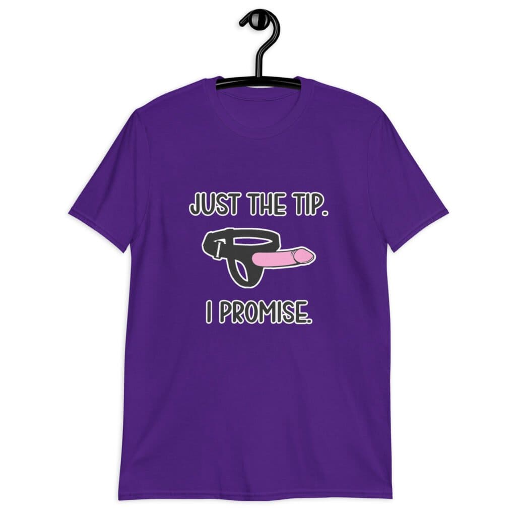 Purple t-shirt that has an image of a strap-on dildo and the words 'Just the tip. I promise.' printed on the front.