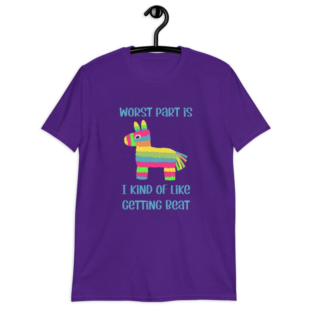 Purple t-shirt with an image of a colorful donkey pinata with the words 'Worst part is I kind of like getting beat' printed on the front.