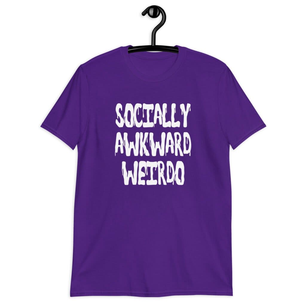Purple t-shirt with the text 'Socially awkward weirdo' printed on the front.