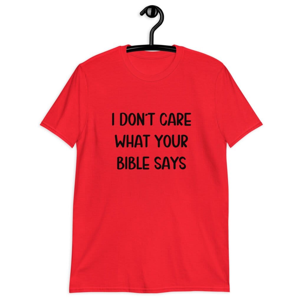 Red t-shirt with the text 'I don't care what your bible says' printed on the front.