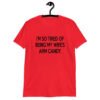 Red t-shirt with the funny phrase 'I'm so tired of being my wife's arm candy' printed on the front.