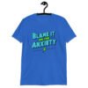 Royal blue t-shirt with the phrase 'Blame is on the anxiety' printed on the front. The graphics are bold and in aqua and lime green.
