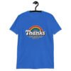 Royal blue t-shirt with an image of a rainbow and the words 'Thanks for the childhood trauma' printed on the front. The word Thanks is large and the rest of the words are smaller under.