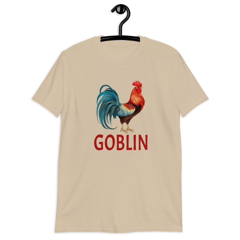 Sand color t-shirt with an image of a rooster and the word 'Goblin' printed under the rooster. The graphics are printed on the front of the shirt.