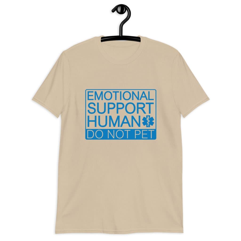 Sand color t-shirt with the text 'Emotional support human. Do not pet' printed on the front.