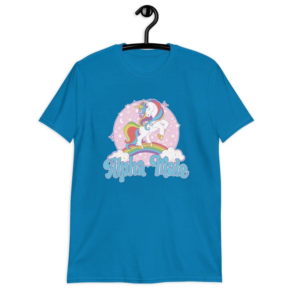 Sapphire blue t-shirt with funny pastel rainbow unicorn graphics and the words Alpha Male printed on the front.