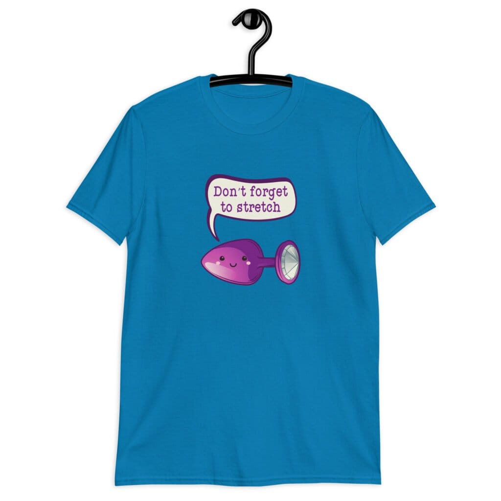 Sapphire blue t-shirt that has image of a purple anal plug with a smile face. There is a speech bubble above with the words 'Don't forget to stretch'. The graphics are printed on the front of the shirt.