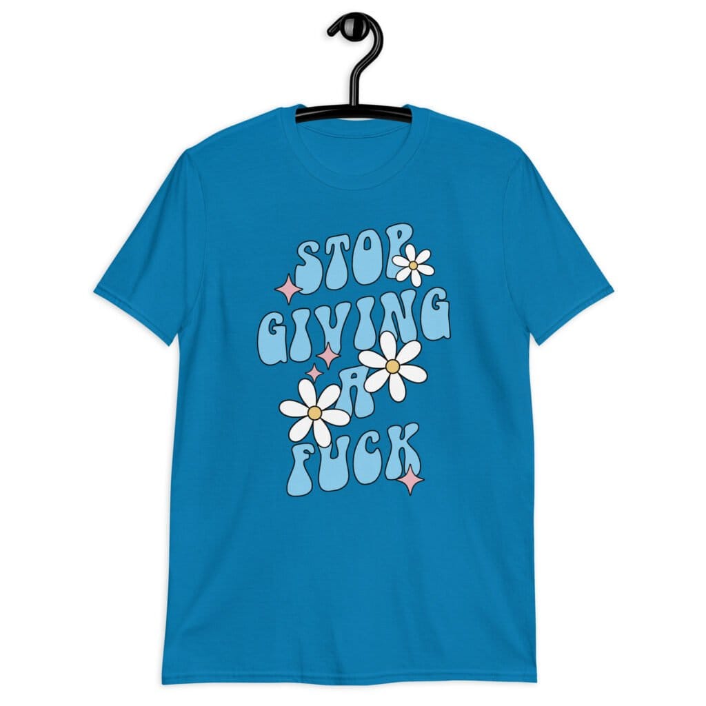 Sapphire blue t-shirt with a retro daisy and star design and the text 'Stop giving a fuck' printed on the front.