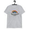 Sport grey t-shirt with an image of a rainbow and the words 'Thanks for the childhood trauma' printed on the front. The word Thanks is large and the rest of the words are smaller under.