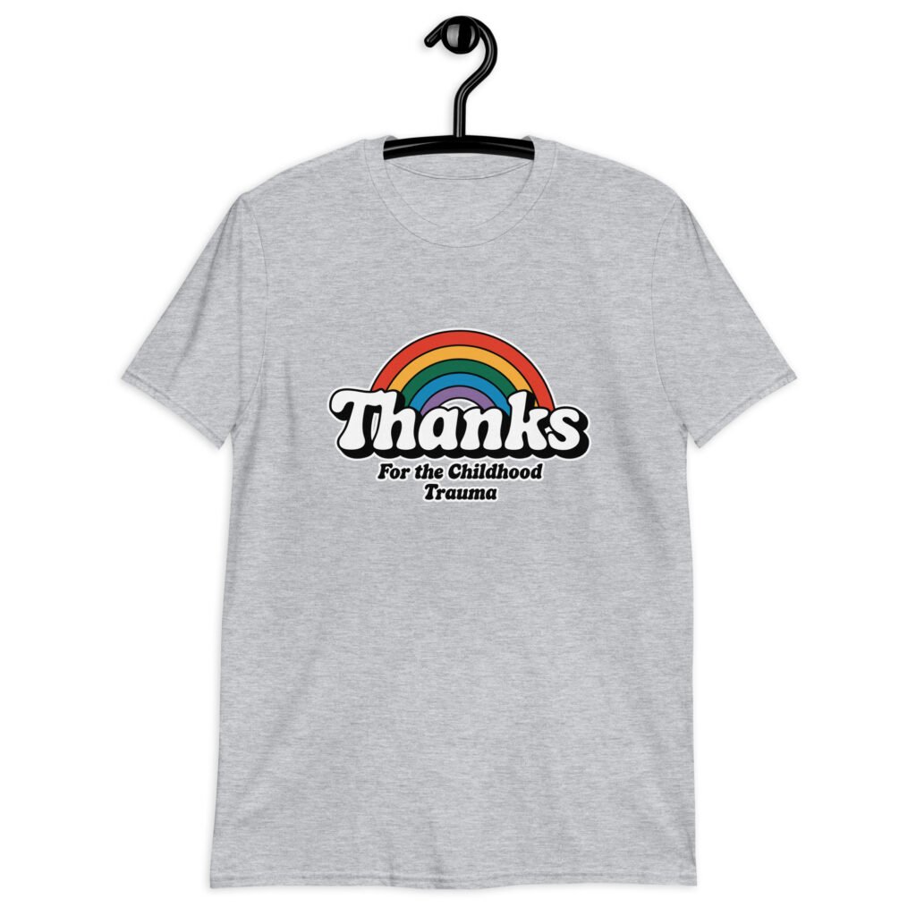 Sport grey t-shirt with an image of a rainbow and the words 'Thanks for the childhood trauma' printed on the front. The word Thanks is large and the rest of the words are smaller under.