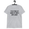 Sport grey t-shirt with the funny phrase 'I'm so tired of being my wife's arm candy' printed on the front.