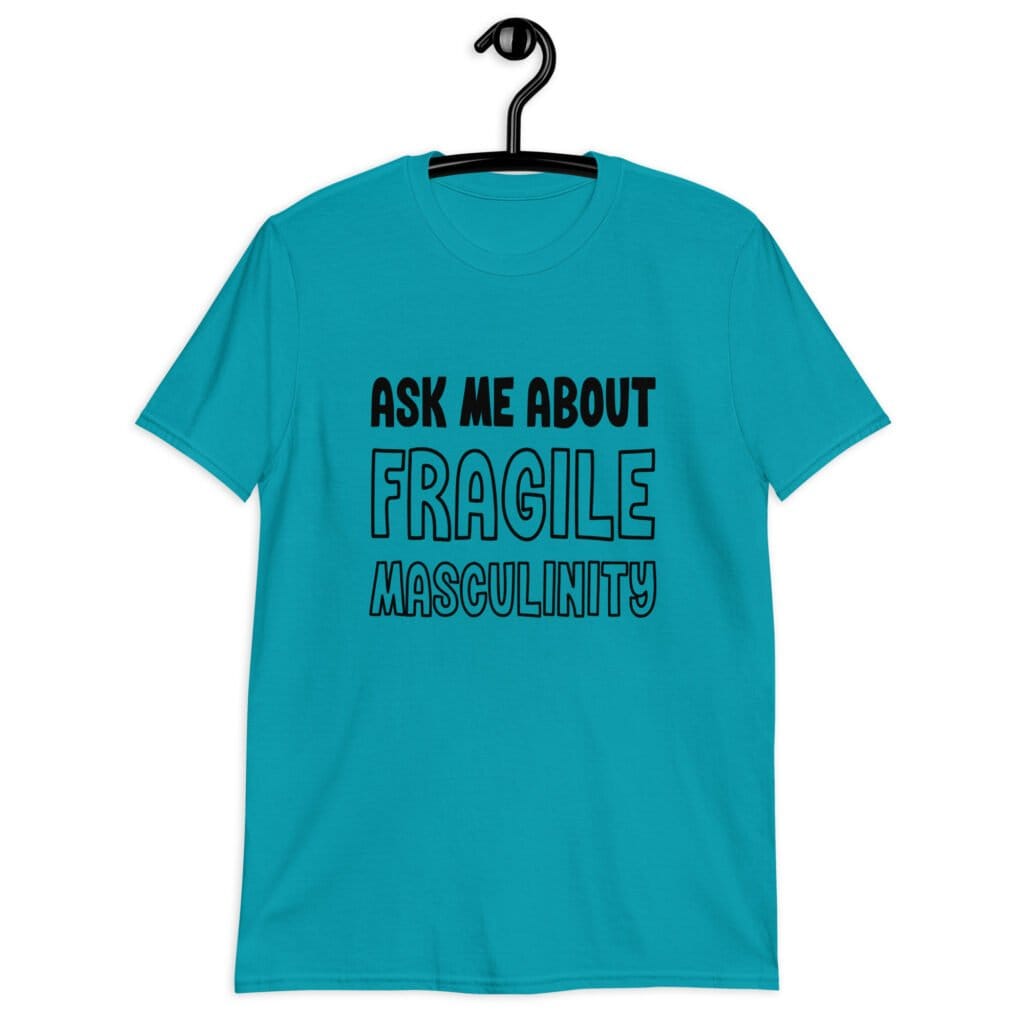 Tropical blue t-shirt with the text 'Ask me about fragile masculinity' printed on the front.