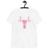 White t-shirt with image of a pink uterus flipping middle finger graphic printed on the front.