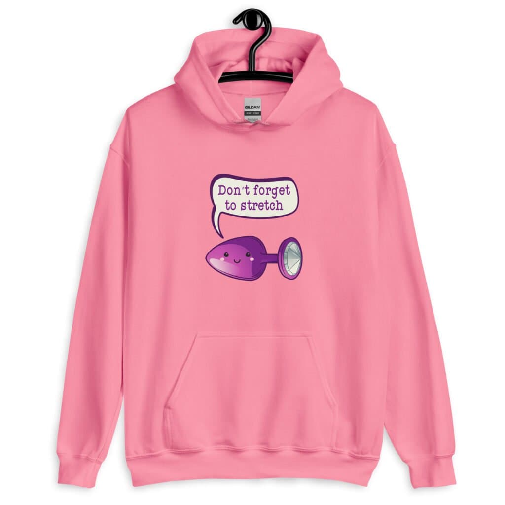 Azalea pink hoodie sweatshirt that has image of a purple anal plug with a smile face with a speech bubble above with the words 'Don't forget to stretch'. The graphics are printed on the front of the hoodie.
