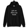 Black hoodie sweatshirt with the text 'Ask me about my fetish' printed on the front.