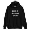 Black hoodie sweatshirt with the text 'At least my trauma made me funny' printed on the front.