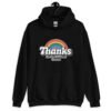 Black hoodie sweatshirt with an image of a rainbow and the words 'Thanks for the childhood trauma' printed on the front. The word Thanks is large and the rest of the words are smaller under.