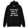 Black hoodie sweatshirt with the text 'Voted most likely to become a cult leader' printed on the front.