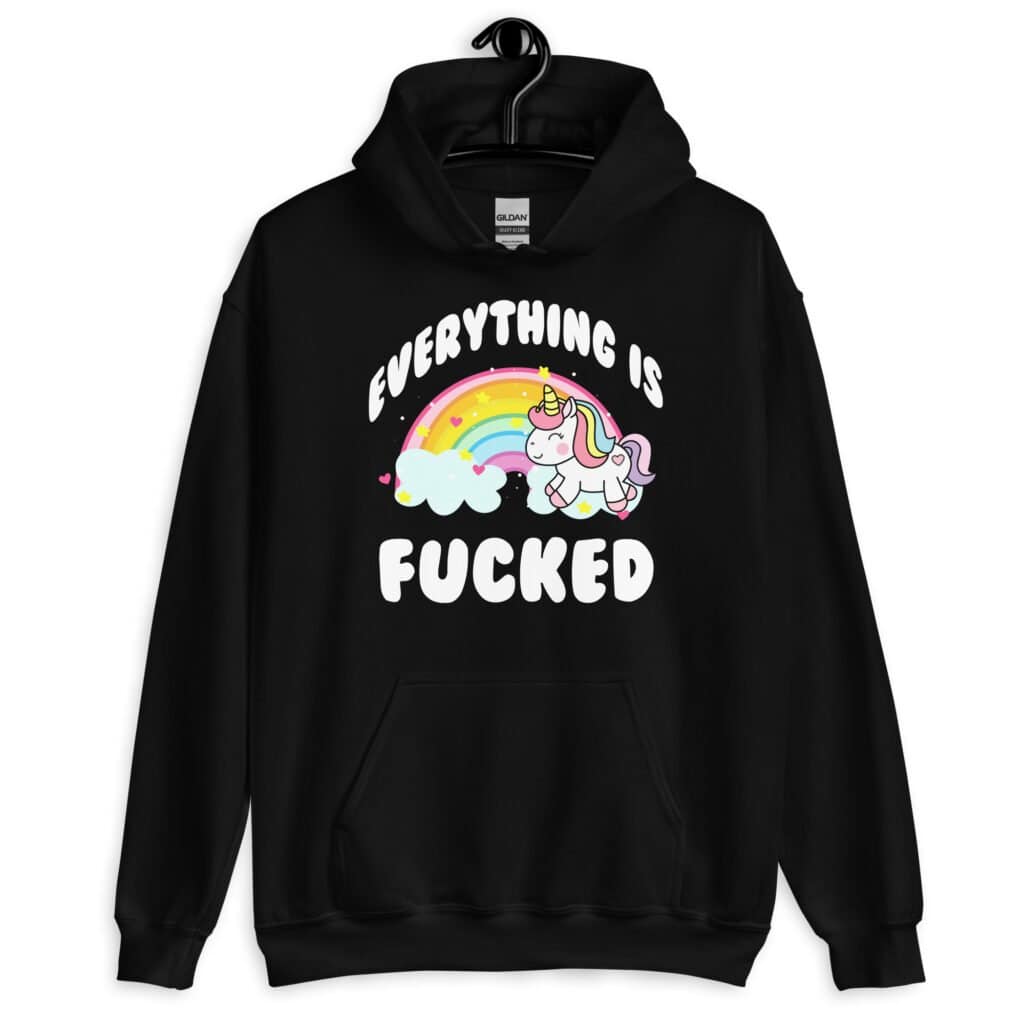 Black hoodie sweatshirt with a graphic of a kawaii style unicorn and a pastel rainbow with the text 'Everything is fucked' printed on the front.