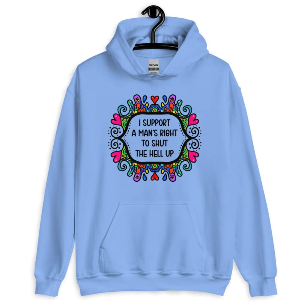 Carolina blue hoodie sweatshirt with a colorful doodle graphic and the words 'I support a man's right to shut the hell up.' The design is printed on the front.