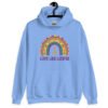 Carolina blue hoodie sweatshirt with an image of a boho style rainbow. There is an upside down cross in the center arch of the rainbow and the text 'Love like Lucifer' printed under. The graphics are printed on the front.