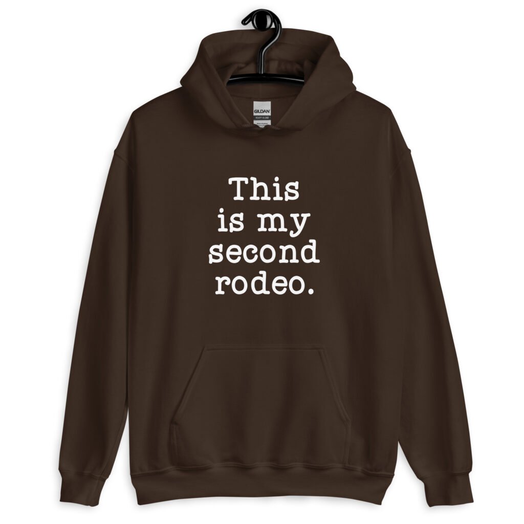 Dark chocolate brown hoodie sweatshirt with the text 'This is my second rodeo.' printed on the front.