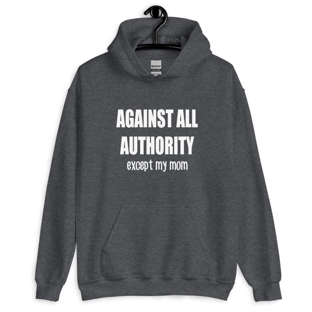 Dark heather grey hoodie sweatshirt with the text 'Against all authority accept my mom' printed on the front.