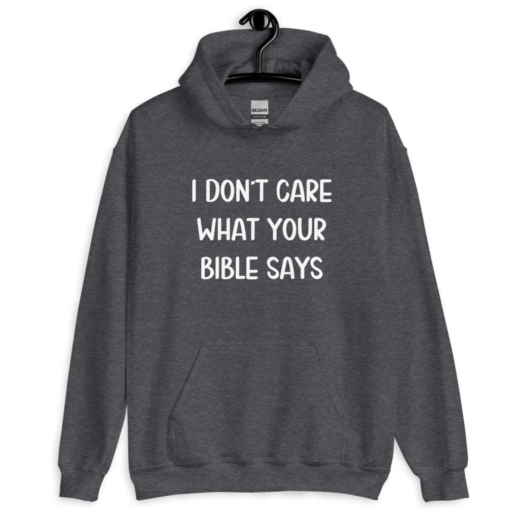 Dark heather grey hoodie sweatshirt with the text 'I don't care what your bible says' printed on the front.