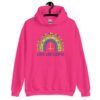 Heliconia pink hoodie sweatshirt with an image of a boho style rainbow. There is an upside down cross in the center arch of the rainbow and the text 'Love like Lucifer' printed under. The graphics are printed on the front.