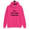 Heliconia pink hoodie sweatshirt with the pun phrase 'I'm a social vegan. I avoid meet.' printed on the front.