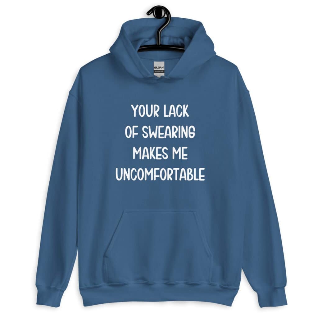 Indigo blue hoodie sweatshirt with the text 'Your lack of swearing makes me uncomfortable' printed on the front.