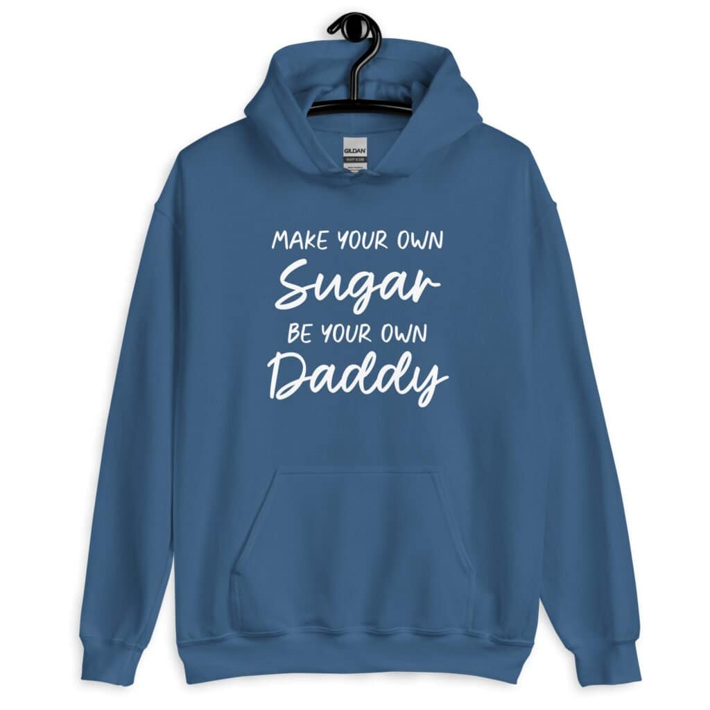 Indigo blue hoodie sweatshirt with the text 'Make your own sugar Be your own Daddy' printed on the front.