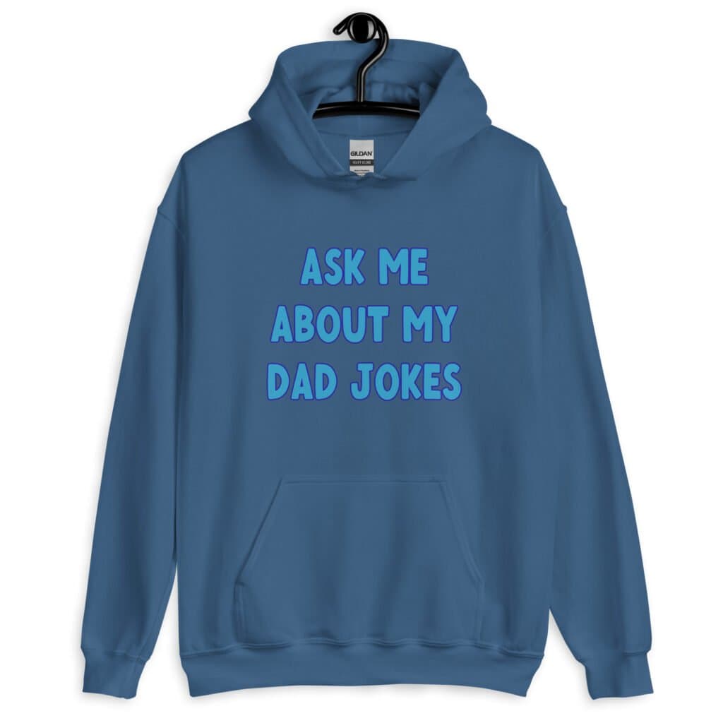 Indigo blue hoodie sweatshirt with the text 'Ask me about my Dad jokes' printed on the front.